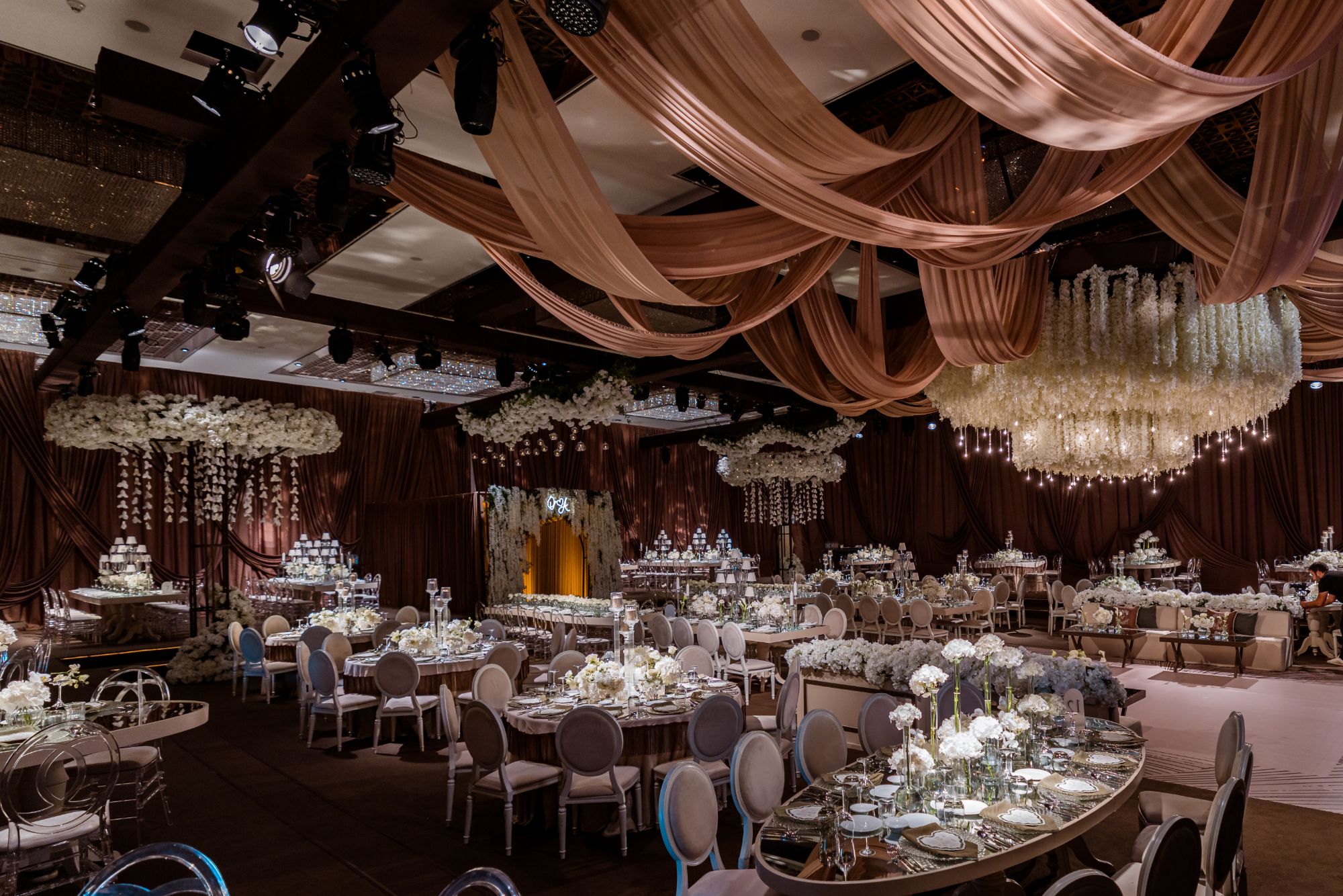 Rose-gold draped ballroom reception